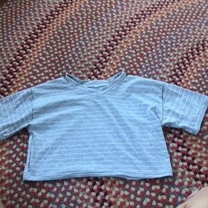 Crop top with slits at the neck.